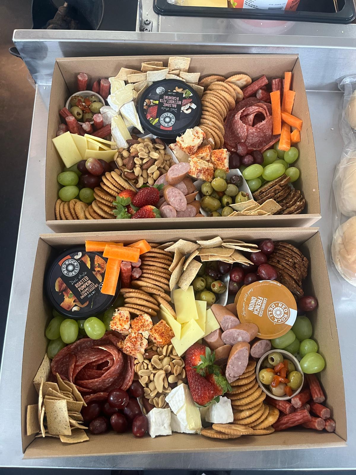 Grazing platter boxes with cured meats, cheeses, crackers, dips, fruit and olives by Ballarat Catering Company